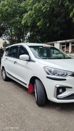 White Ertiga car hire in Solapur