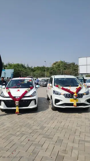 New cabs of Shourya Tours & Travels after vehicle pooja in Solapur